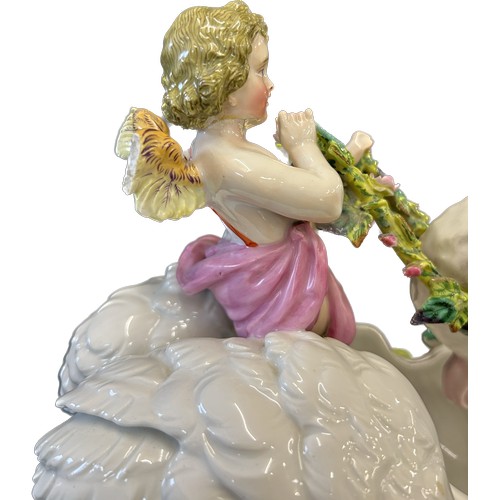 7 - Antique porcelain swan and cherub ornament, with flowers, leaves and fruit, this piece is damaged as... 