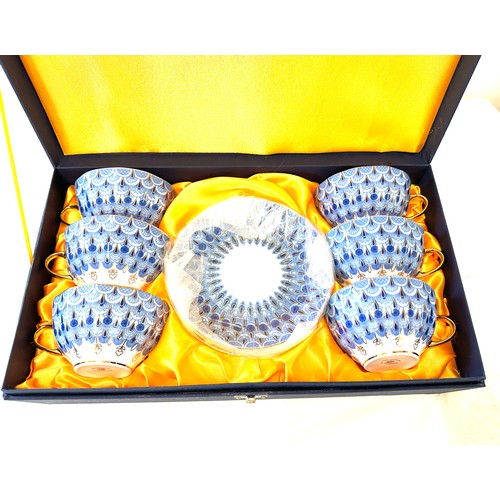 56 - Cased St Petersburg 12 piece tes set, blue white and gold design