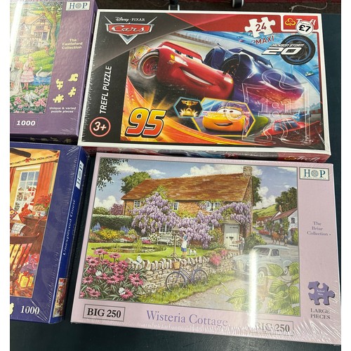 292 - Selection of brand new puzzles includes Lightening Mcqueen, Twenties Green etc