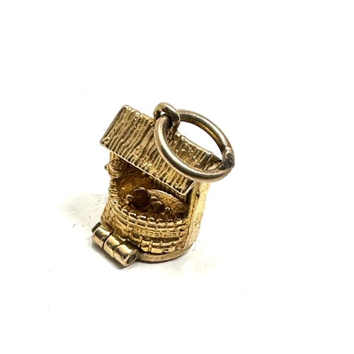 37 - 9ct gold nuvo opening gold wishing well charm weight 2.4