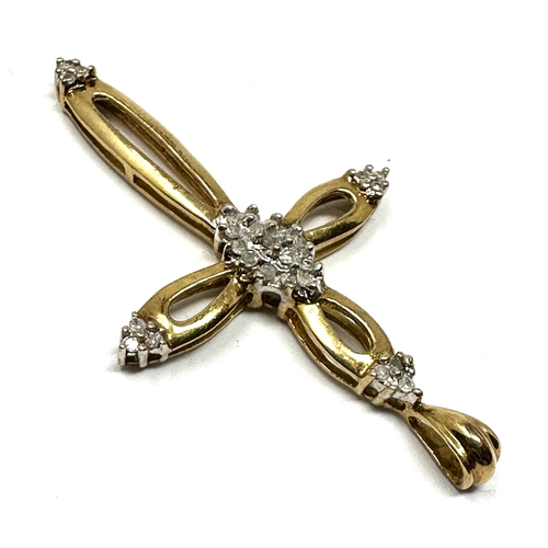 39 - 9ct gold diamond set cross pendant measures approx 4.2cm by 2.4cm weight 2g