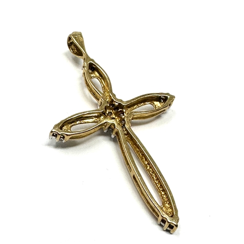 39 - 9ct gold diamond set cross pendant measures approx 4.2cm by 2.4cm weight 2g