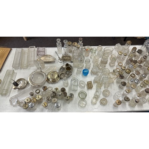 346 - Large selection of silver topped glass jars includes salt and pepper shakers etc