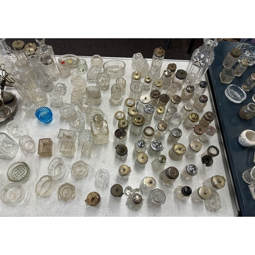 346 - Large selection of silver topped glass jars includes salt and pepper shakers etc