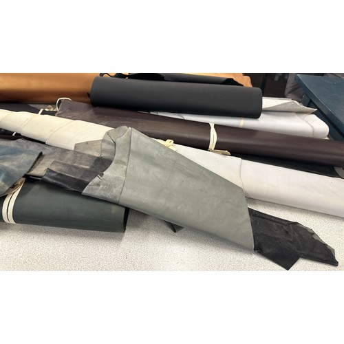 229 - Large selection of assorted leather cut offs largest measures approx 90 inches long 37 inches wide