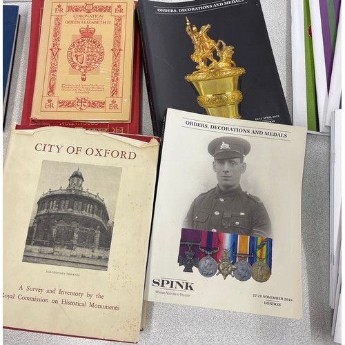 261 - Large selection of vintage medal books and magazines to include Coronation of her Majesty Queen Eliz... 