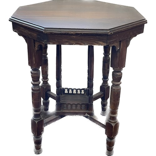 546 - Mahogany octagonal occasional table measures approx- 27.5 inches high by 23 inches wide and deep