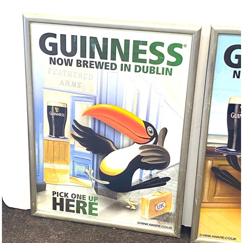 133 - Two framed  Guinness advertising posters '  Guinness now brewed in Dublin' measures approximately 24... 