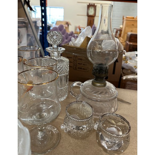 312 - Large selection of vintage and later glassware includes decanters, oil lamp, glasses etc