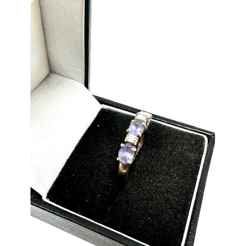 132 - 9ct white gold tanzanite three stone ring (3g)