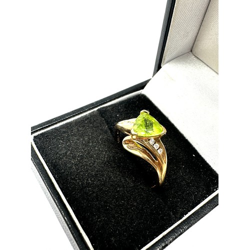 97 - 10ct gold peridot ring with diamond accents (2.4g)