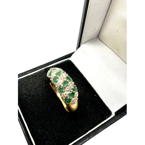 143 - 9ct gold diamond & emerald dress ring (3.9g)