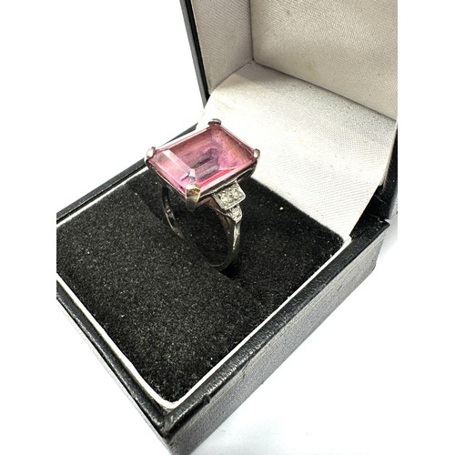 158 - 9ct white gold baguette cut pink topaz ring with diamond set shank (5.1g)