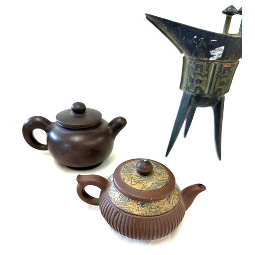 32 - Selection of Chinese/ Oriental items includes chinese wine cup and a selection of tea pots, marks to... 