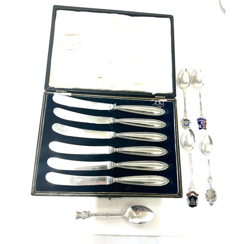 356 - Set of six silver butter knives in original box and a selection of silver spoons