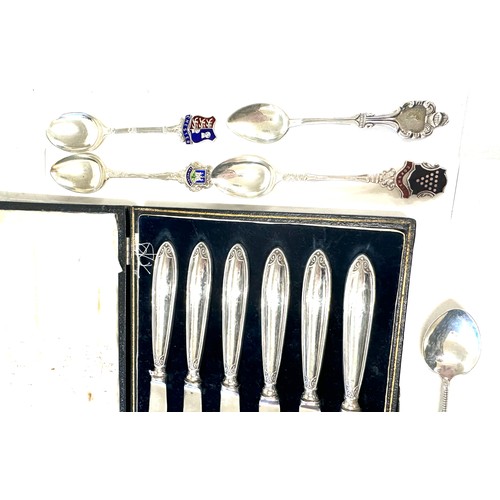 356 - Set of six silver butter knives in original box and a selection of silver spoons