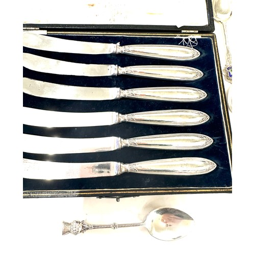 356 - Set of six silver butter knives in original box and a selection of silver spoons