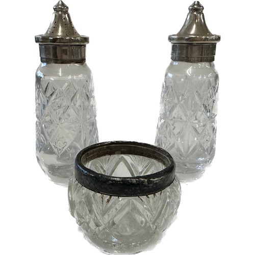 379 - Pair of silver lidded salt and pepper pot and a silver rimmed pot