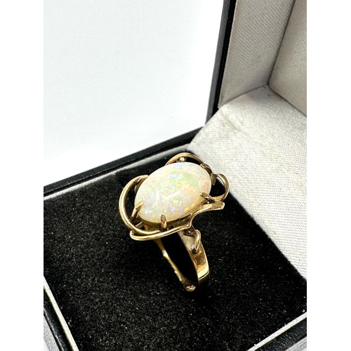 189 - 14ct gold opal ring with wavy openwork frame (2.7g)