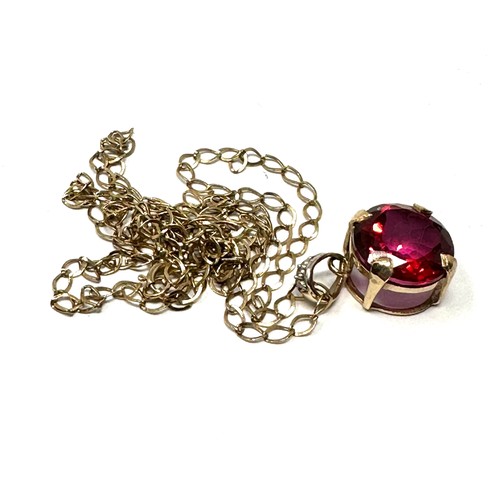 191 - 9ct gold  red topaz pendant necklace (2.3g)