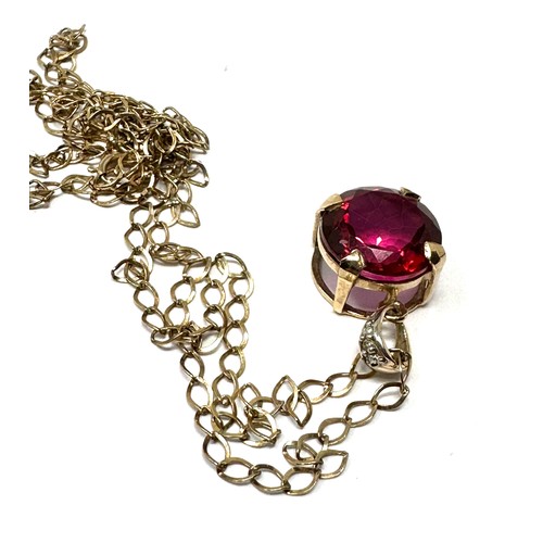 191 - 9ct gold  red topaz pendant necklace (2.3g)