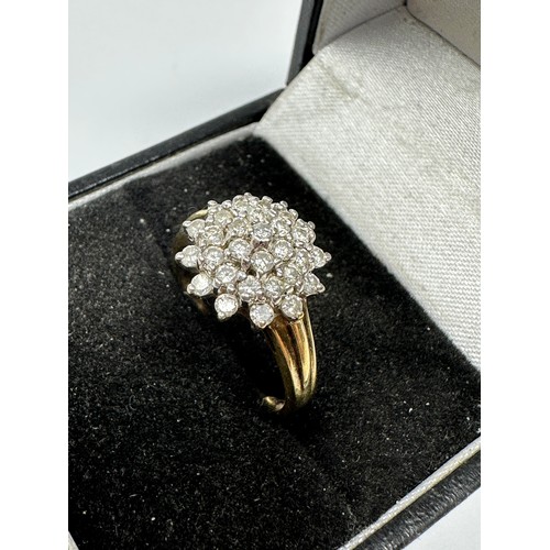 151 - 9ct gold diamond halo ring (2.5g)