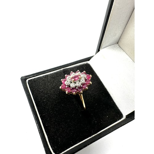 156 - 9ct gold diamond & ruby dress ring (2.1g)