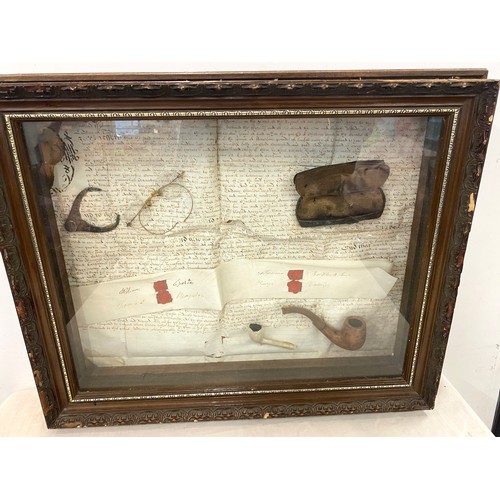 37 - Cased diorama includes spectacles and smoking pipes, case measures approx 16 inches by 21 inches