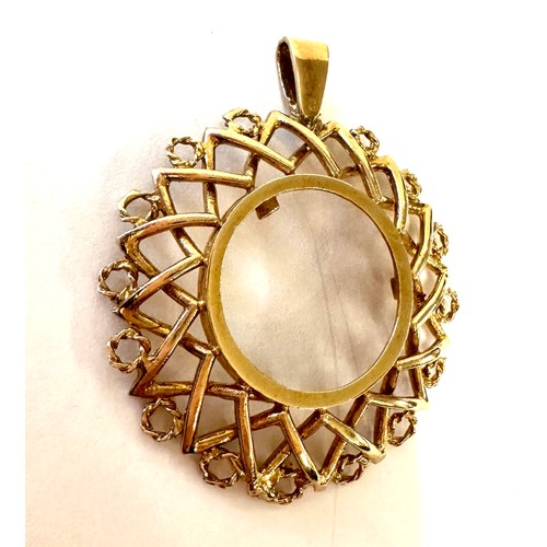 446 - 9ct gold sovereign mount pendant, hallmarked, total weight 8.6grams measures approximately 5cm by 4c... 