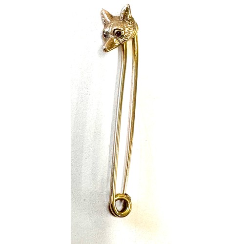 422 - 9ct Gold fox head bar brooch, weight approx 7.1 grams, hallmarked, 6cm long