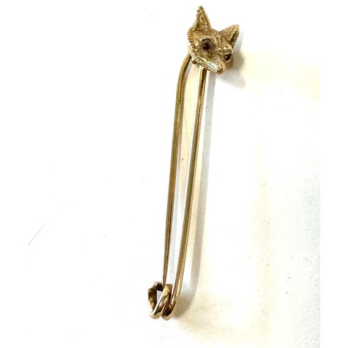 422 - 9ct Gold fox head bar brooch, weight approx 7.1 grams, hallmarked, 6cm long