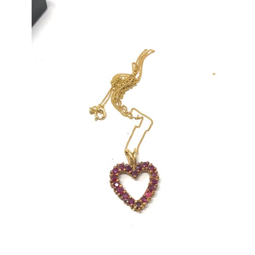 419 - 14ct gold ruby set heart pendant necklace (2.7g)