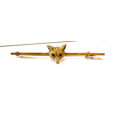 414 - 9ct Gold fox head bar brooch, weight approx 2.9 grams, hallmarked, 5.5cm long