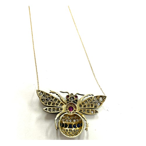 447 - Large diamond butterfly pendant on gold chain, butterfly details diamonds, sapphires and rubies whic... 