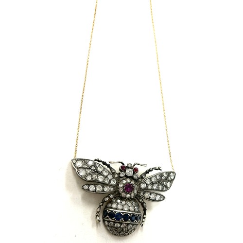 447 - Large diamond butterfly pendant on gold chain, butterfly details diamonds, sapphires and rubies whic... 