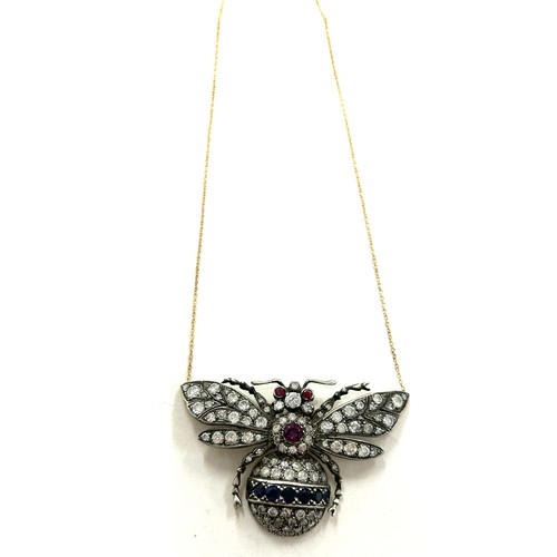 447 - Large diamond butterfly pendant on gold chain, butterfly details diamonds, sapphires and rubies whic... 