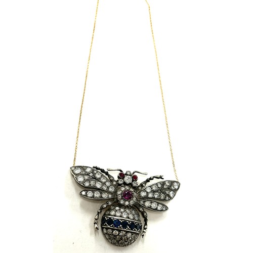 447 - Large diamond butterfly pendant on gold chain, butterfly details diamonds, sapphires and rubies whic... 