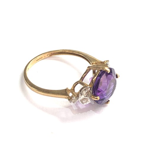 400 - 9ct Amethyst ring with floral diamond shoulders weight 2.4g