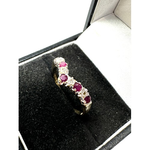 147 - 9ct gold diamond & ruby chevron ring (1.7g)