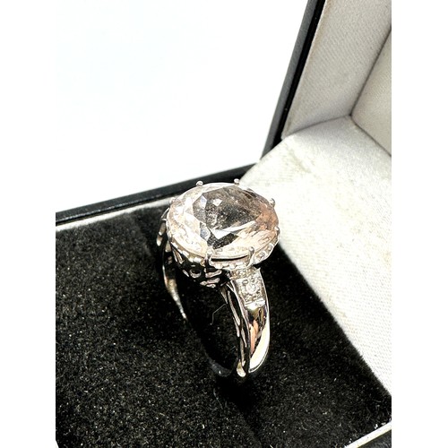 157 - 9ct white gold oval cut goshenite solitaire ring with diamond accents (3.5g)