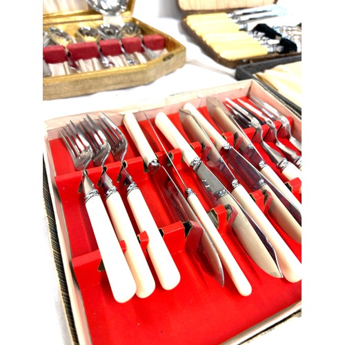 105 - 4 Vintage boxed cutlery sets