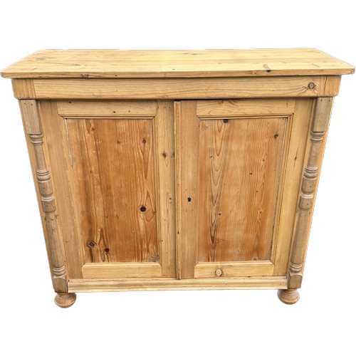 567 - Stripped pine 2 door cupboard measures approximately 37 inches tall 40 inches wide 16 inches depth