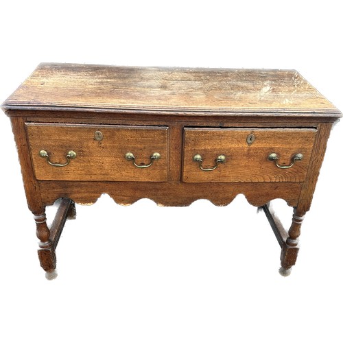 569 - Oak antique 2 drawer low side board measures approx 30 inches tall 43 inches wide 20 inches depth