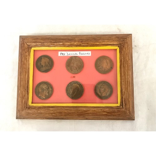 100 - Selection of framed coins includes pre decimal pennies etc