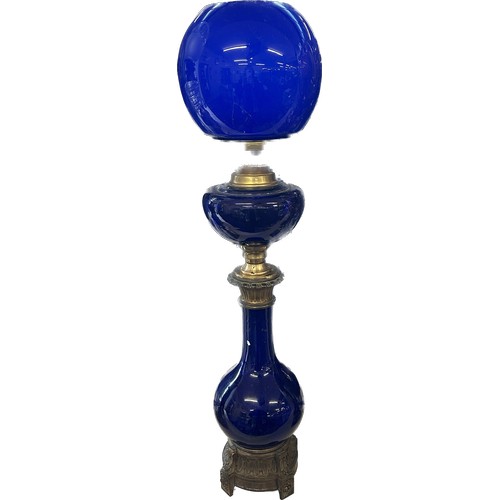 518 - Antique blue glass brass based oil lamp complete with funnel and shade