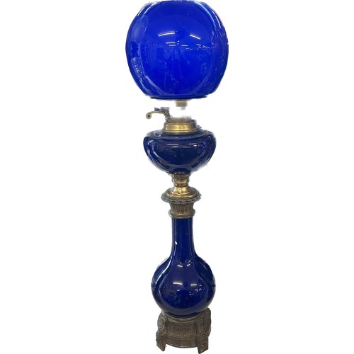 518 - Antique blue glass brass based oil lamp complete with funnel and shade