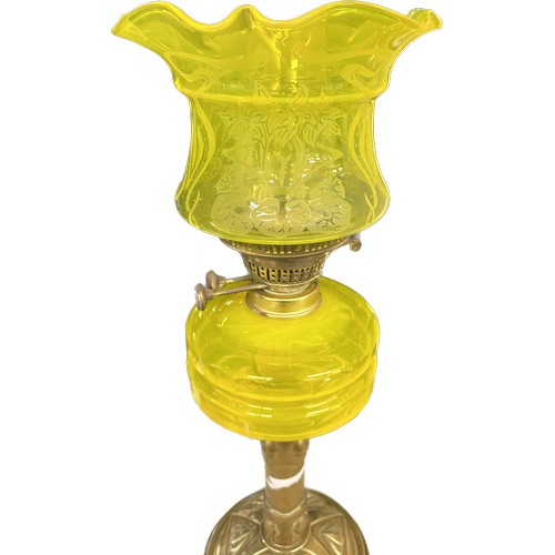 521 - Antique brass bass yellow glass oil lamp complete with funnel and shade