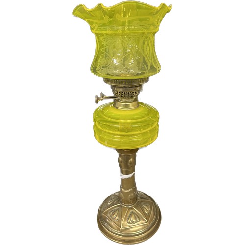 521 - Antique brass bass yellow glass oil lamp complete with funnel and shade