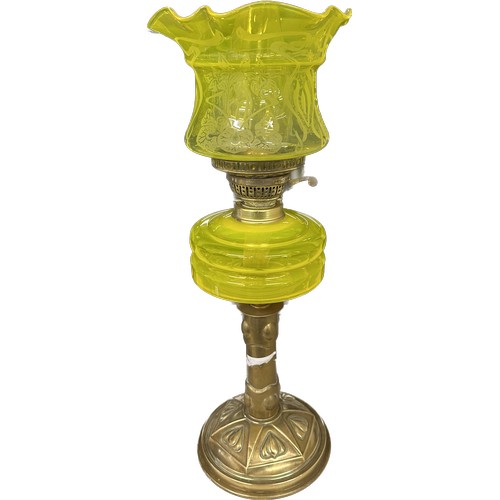 521 - Antique brass bass yellow glass oil lamp complete with funnel and shade