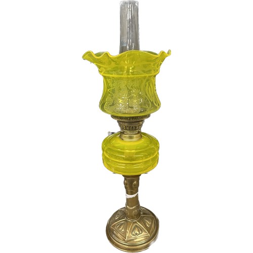 521 - Antique brass bass yellow glass oil lamp complete with funnel and shade